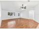 Living room with wood flooring and access to other rooms at 10962 Sw 81St Ave, Ocala, FL 34481
