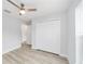 Well-lit bedroom with ceiling fan and large closet at 14897 Sw 27Th Ln, Ocala, FL 34481