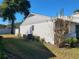 Rear view of house showing exterior condition and landscaping at 1906 Se 37Th Court Cir, Ocala, FL 34471