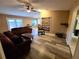 Spacious living room with wood-look floors and built-in shelves at 1906 Se 37Th Court Cir, Ocala, FL 34471