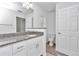 Bathroom with granite countertop, toilet and single vanity at 19925 Sw Lark Dr, Dunnellon, FL 34431