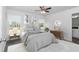 Bright bedroom with a queen-size bed and neutral decor at 19925 Sw Lark Dr, Dunnellon, FL 34431