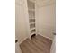 Large walk-in closet with shelving and hanging rods at 2444 Se 18Th Cir, Ocala, FL 34471