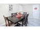 Bright dining area with a dark wood table and six chairs at 4911 Ne 13Th St, Ocala, FL 34470