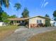 Single story home with a landscaped yard at 4911 Ne 13Th St, Ocala, FL 34470