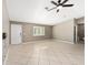 Living room with tile floors, a ceiling fan, and entryway at 5971 Sw 99Th Pl, Ocala, FL 34476