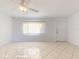 Spacious living room featuring tile floors and a ceiling fan at 6263 Sw 115Th Street Rd, Ocala, FL 34476