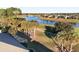 Aerial view of home backyard, palm trees, and a lake at 6671 Sw 97Th Terrace Rd, Ocala, FL 34481