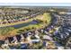 Aerial view of community with golf course and lake at 6671 Sw 97Th Terrace Rd, Ocala, FL 34481