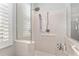 Large walk-in shower with grab bars and window at 6671 Sw 97Th Terrace Rd, Ocala, FL 34481