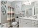 Clean bathroom with a shower/tub combo, white vanity, and updated fixtures at 6671 Sw 97Th Terrace Rd, Ocala, FL 34481