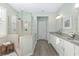Elegant bathroom with double sinks and a walk-in shower at 6671 Sw 97Th Terrace Rd, Ocala, FL 34481