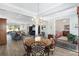 Bright dining room with chandelier and seating for six at 6671 Sw 97Th Terrace Rd, Ocala, FL 34481