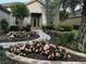 Landscaped front yard with walkway and rose bushes at 6671 Sw 97Th Terrace Rd, Ocala, FL 34481