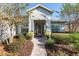 Landscaped entryway with a brick walkway, lush greenery, and a welcoming front door at 6671 Sw 97Th Terrace Rd, Ocala, FL 34481