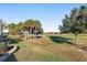 Peaceful backyard view of golf course and palm trees at 6671 Sw 97Th Terrace Rd, Ocala, FL 34481
