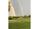 Double rainbow over scenic golf course landscape at 6671 Sw 97Th Terrace Rd, Ocala, FL 34481