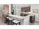 Modern kitchen with granite countertops and breakfast bar at 6671 Sw 97Th Terrace Rd, Ocala, FL 34481