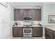 Well-equipped kitchen with granite countertops and modern appliances at 6671 Sw 97Th Terrace Rd, Ocala, FL 34481