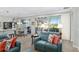 Open concept living room with patio access and seating area at 6671 Sw 97Th Terrace Rd, Ocala, FL 34481