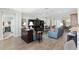 Open concept living area with hardwood floors and comfortable seating at 6671 Sw 97Th Terrace Rd, Ocala, FL 34481