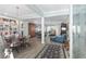 Open-concept living and dining space with hardwood floors, built-in bookcases, and a view of the backyard at 6671 Sw 97Th Terrace Rd, Ocala, FL 34481