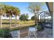 Relax on this patio overlooking the golf course and palm trees at 6671 Sw 97Th Terrace Rd, Ocala, FL 34481