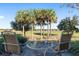 This patio offers a tranquil setting with seating and golf course views at 6671 Sw 97Th Terrace Rd, Ocala, FL 34481