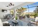 Large screened patio perfect for entertaining, featuring multiple seating areas at 6671 Sw 97Th Terrace Rd, Ocala, FL 34481