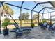 Enjoy the view from this screened patio with chaise lounge and seating at 6671 Sw 97Th Terrace Rd, Ocala, FL 34481