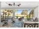Spacious screened patio with seating area and golf course view at 6671 Sw 97Th Terrace Rd, Ocala, FL 34481