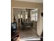 Small dining area with table and chairs in a sunlit alcove at 8120 Nw 47Th Ln, Ocala, FL 34482