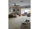 Spacious living room with comfortable seating and a view into a sunroom at 8120 Nw 47Th Ln, Ocala, FL 34482