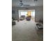 Spacious living room with comfortable seating and a view into a sunroom at 8120 Nw 47Th Ln, Ocala, FL 34482