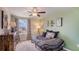 Charming bedroom with a daybed and patterned bedding at 8469 Las Palmas Way, Wildwood, FL 34785