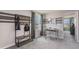 Bedroom with desk, coat rack, and view of the backyard at 8469 Las Palmas Way, Wildwood, FL 34785