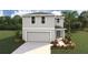 Two-story house with gray siding, two-car garage, and landscaped yard at 8469 Las Palmas Way, Wildwood, FL 34785