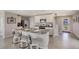 Modern kitchen with granite countertops, stainless steel appliances, and island at 8469 Las Palmas Way, Wildwood, FL 34785