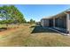 Landscaped backyard view with golf course in background at 9350 Sw 91St Court Rd, Ocala, FL 34481