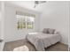 Bright bedroom with plush carpet and ceiling fan at 9350 Sw 91St Court Rd, Ocala, FL 34481