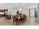 Open concept dining room with kitchen access and a large dining table at 9350 Sw 91St Court Rd, Ocala, FL 34481