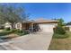 Front view of house with driveway and landscaping at 9350 Sw 91St Court Rd, Ocala, FL 34481