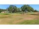 Expansive view of the golf course with large trees at 9350 Sw 91St Court Rd, Ocala, FL 34481