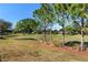 View of a lush green golf course with mature trees at 9350 Sw 91St Court Rd, Ocala, FL 34481
