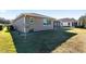 Side view of house showing satellite dish and landscaping at 9350 Sw 91St Court Rd, Ocala, FL 34481