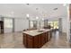 Open kitchen with large island that overlooks Gathering and dining areas at 9350 Sw 91St Court Rd, Ocala, FL 34481