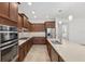 Open concept kitchen with stainless steel appliances and light cabinetry at 9350 Sw 91St Court Rd, Ocala, FL 34481