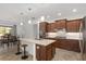 Spacious kitchen with island, stainless steel appliances, and ample cabinetry at 9350 Sw 91St Court Rd, Ocala, FL 34481