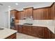 Well-equipped kitchen with stainless steel appliances and wood cabinetry at 9350 Sw 91St Court Rd, Ocala, FL 34481
