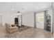 Bright living room with hardwood floors, large windows and a cozy seating area at 9350 Sw 91St Court Rd, Ocala, FL 34481